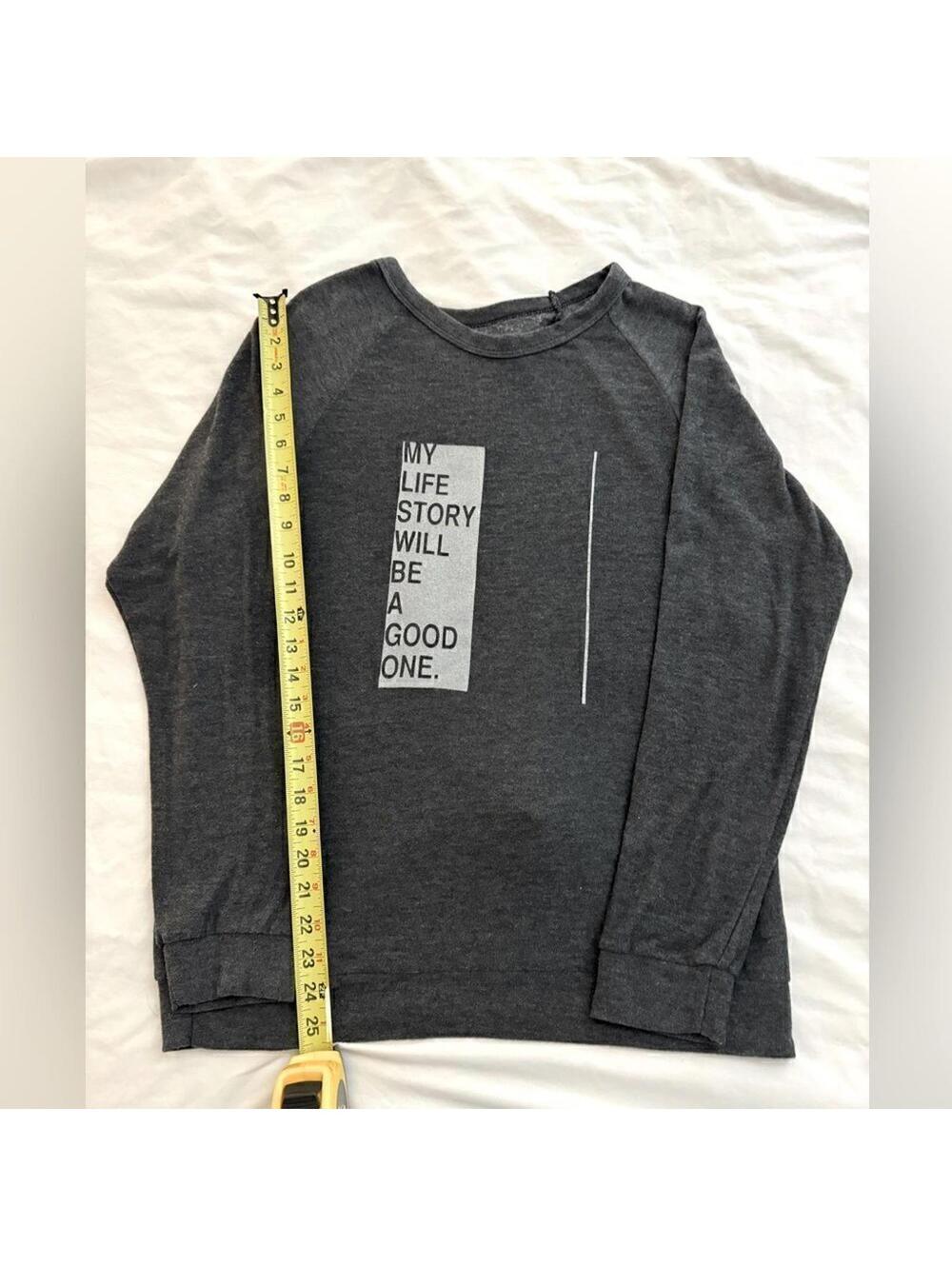 good hYOUman charcoal gray sweatshirt with inspirational text on the front. med.